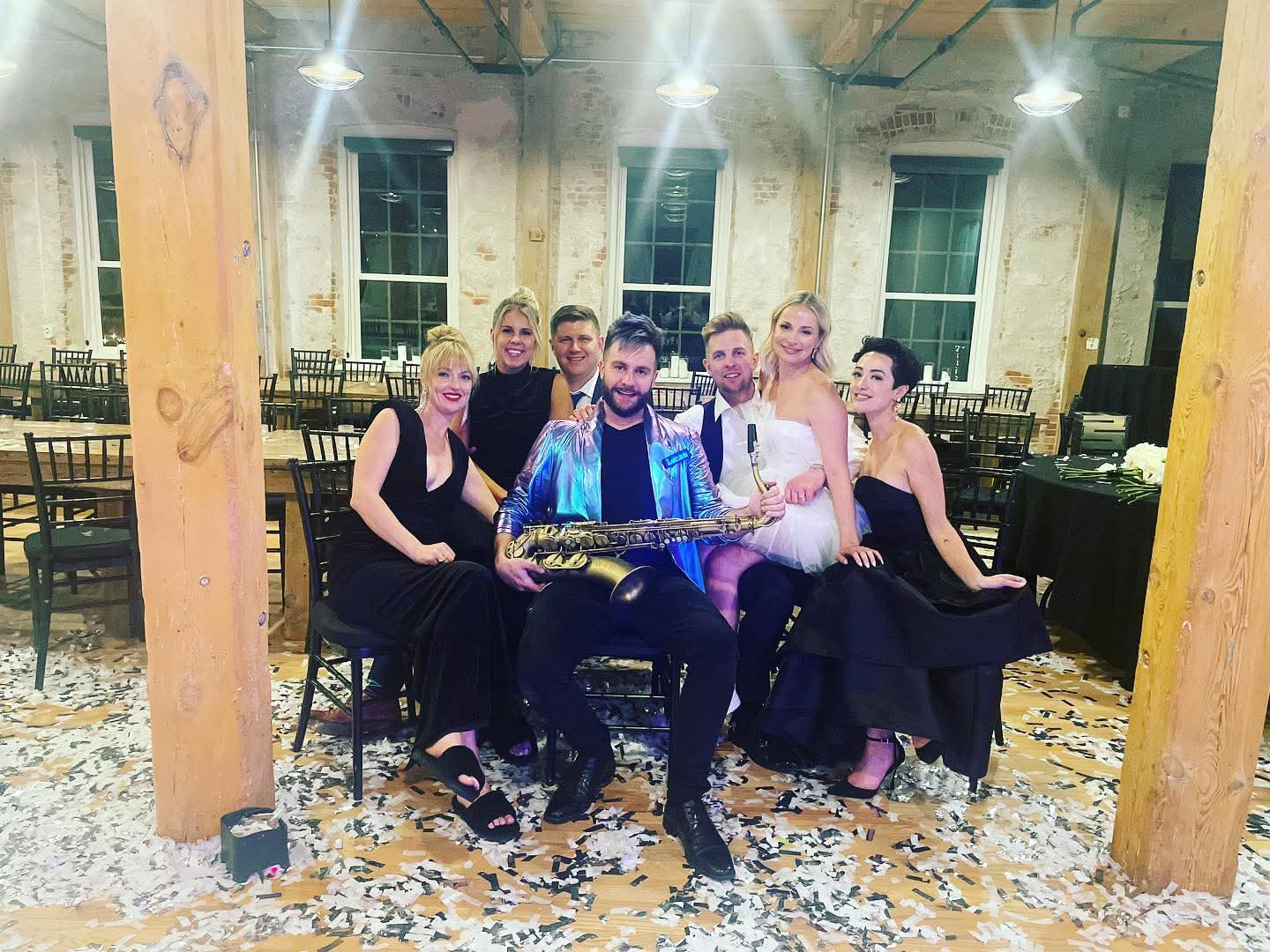 Lucas with a bridal party on the dance floor after the reception